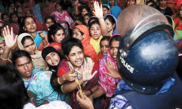 Thousands of workers clash with police over poor pay in Bangladesh