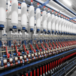 Removal of QCOs on Polyester Fibre and Yarn to aid MMF Growth